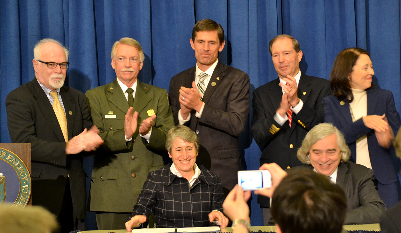 The signing ceremony of park. In the photo are David Klaus, Deputy Under Secretary at DOE; Jonathan Jarvis, Director of the National Park Service, Senators Martin Heinrich, Tom Udall, & Maria Cantwell; Secretaries Sally Jewell & Ernie Moniz