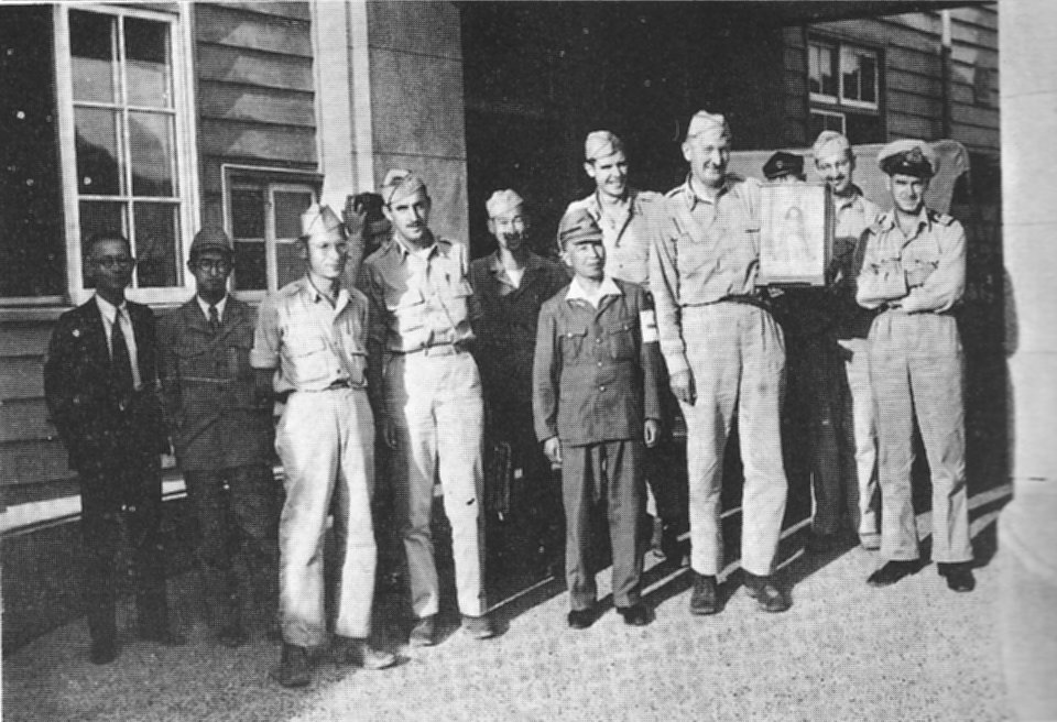 The Nagasaki survey team, including Japanese interpreters and guides
