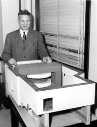 Robert Hutchins with Cyclotron Model 1. University of Chicago Photographic Archive, apf2-00155, Special Collections Research Center, University of Chicago Library.