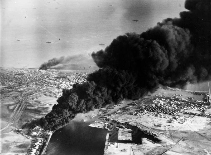 Oil tanks near the Suez Canal burn, 1956